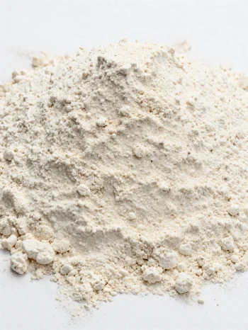 Spelt flour in a ceramic bowl, natural light brown shade
