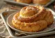 Kanelbulle sprinkled with cinnamon sugar, served fresh baked