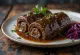 Rinderrouladen served with vegetables and gravy