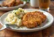Breaded beef fillet served with mashed potatoes and parsley