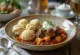 Beef stew served with ewe's cheese dumplings and sour cream