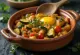 Classic Alboronía, rich flavours, garnished with fresh coriander