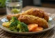 Breaded duck leg served with vegetables