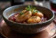 Red wine & coconut sauce with garlic served