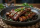 Char-grilled galbi, served with sesame seeds and coriander