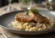 Pork neck steaks served with mushroom risotto