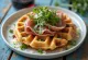 Prosciutto and parmesan waffles served with rocket and balsamic vinegar