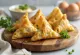 Cauliflower and pea samosas served