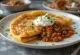 Goulash pancake served with beef filling and sour cream