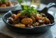 Tamari mushrooms, a spicy dish made with tamari soy sauce and fresh mushrooms, garnished with coriander and lime leaf