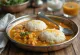 Freshly made idli with sambar, steamed idli and spicy lentil sauce