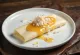 Beiju sweetened with honey, garnished with desiccated coconut