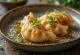 Crispy fried gyoza dumplings served with sesame oil, alongside soy sauce