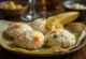 Fresh steaming vegetable idli served with fresh coriander