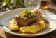 Osso buco served with polenta, in vegetable sauce, sprinkled with gremolata
