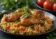 Chicken Kabsa, spiced rice garnished with toasted almonds