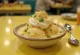 Steamed sundae garnished with cinnamon, sour cream and sesame seeds