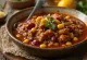 Chili con carne served with rice and tortilla chips