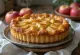 Treacle tart with apple, in fresh pastry and rich golden syrup filling