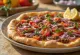 Lahmacun: minced meat topping on thin dough, served with fresh vegetables and lemon