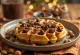 Hazelnut and chocolate chip waffles with melted chocolate and roasted hazelnuts