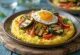 Polenta with grilled vegetables, served on a plate with colourful vegetable slices on top