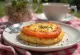 Welsh rarebit with tomato served, in cheese sauce, on toast, with fresh tomato pieces