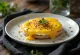 Welsh rarebit with egg served, in cheese sauce, on toast