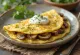Mushroom omelette with sour cream, served in a pan