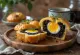 Black pudding egg muffin, topped with shiny egg