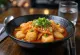 Kimchi tteokbokki - Korean rice cake served with spicy kimchi and sesame seeds