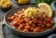 Gigantes Plaki with fresh parsley, served with fresh bread
