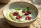 Probiotic yoghurt served with cherries and matcha powder