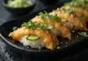 Inari sushi served with cucumber and sprinkled with sesame seeds