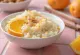 Creamy risengrød served with fresh grated orange zest and cinnamon