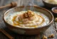 Cinnamon Congee served as rice porridge, garnished with cinnamon and fruit