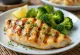 Grilled chicken breast with steamed broccoli, served with fresh parsley