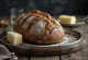 Ruislimppu shaped classic Finnish rye bread, dark brown, with floured crust