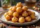 Loukoumades with yoghurt dough, served with honey and cinnamon